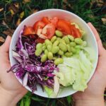 Green and Red Sliced Vegetables in White Ceramic Bowl