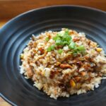 Cooked Rice on Black Ceramic Plate