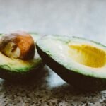 Selective Focus Photography Of Sliced Avocado