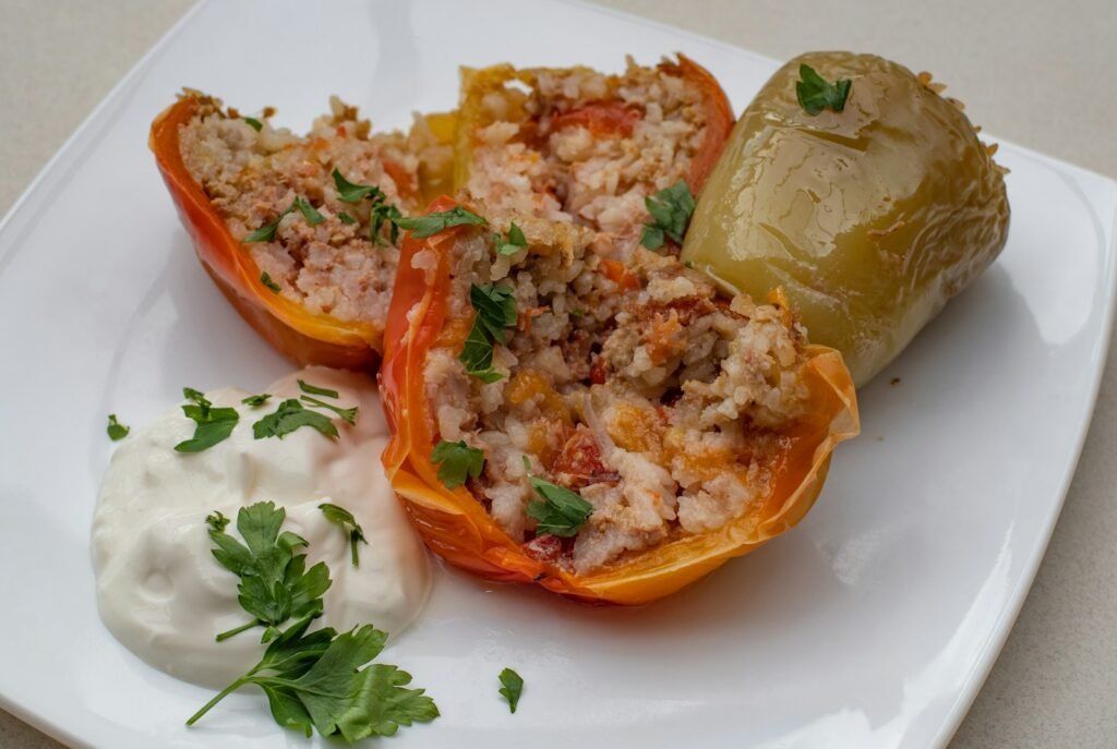 a white plate topped with stuffed bell peppers